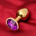 Золотистая анальная пробка с фиолетовым кристаллом